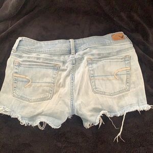 Size 8 distressed, light jean shorts.